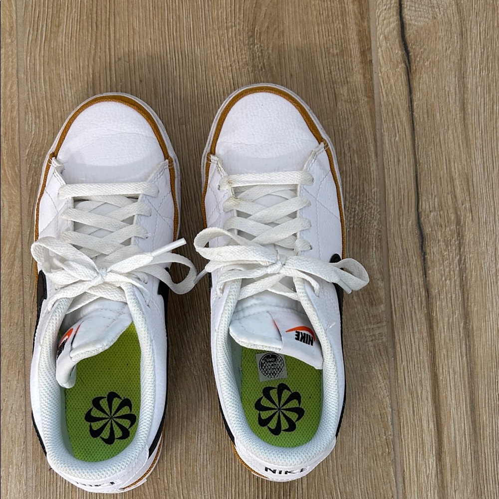 Gently Used Nike Women’s Black and White Sneakers